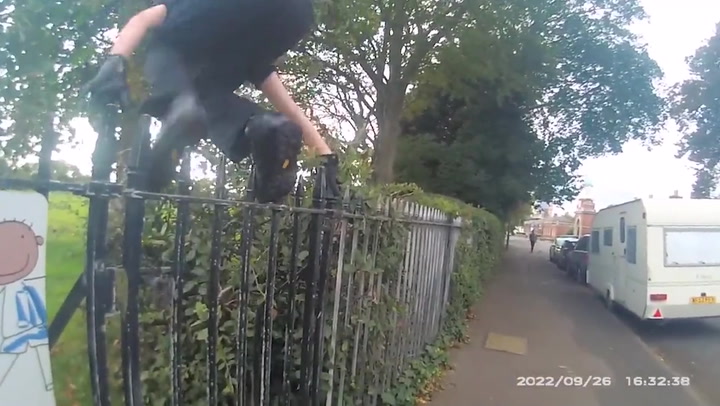 Police officer falls head-first over school gate
