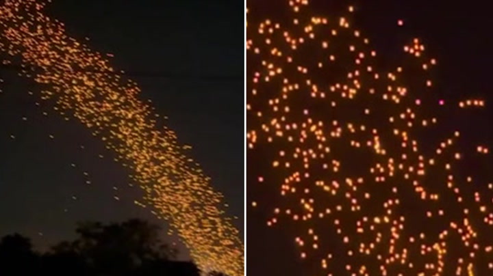 Thousands of floating lanterns form mesmerising stream of lights during Thai lantern festival