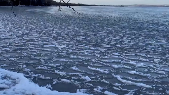 Unusual 'pancake' ice phenomenon covers lake in Wisconsin as temperatures drop