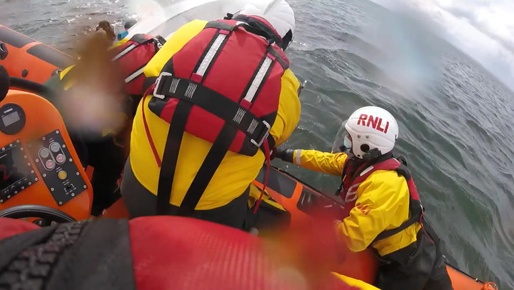Five children and two adults rescued after dinghy capsize
