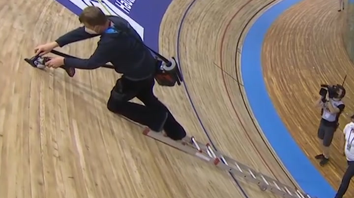 Velodrome track fixed by man on a ladder proves how steep it really is
