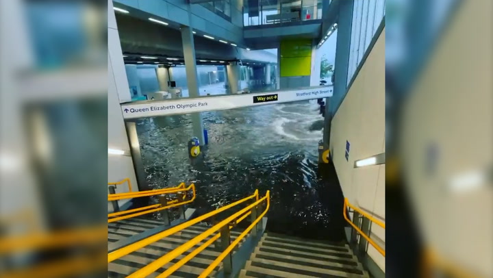 Water gushes into London tube station in flash floods