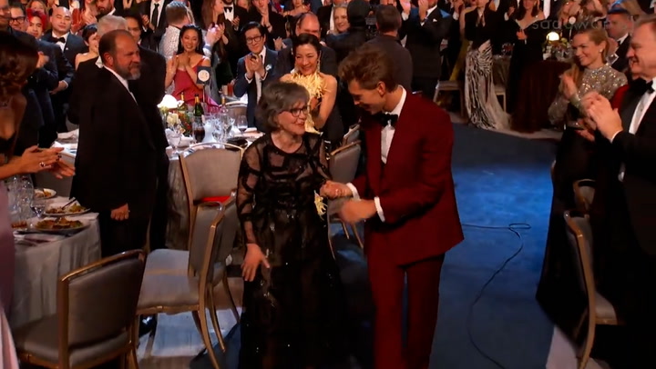Austin Butler escorts Sally Field to stage at SAG Awards