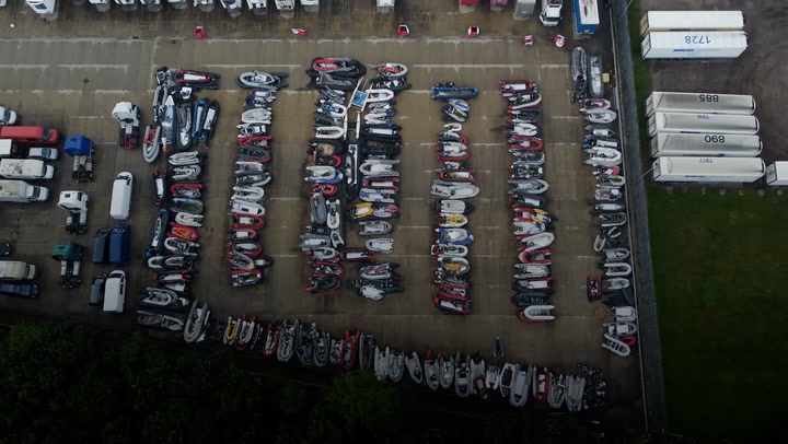 Drone footage show dozens of migrant dinghies stacked up in Dover