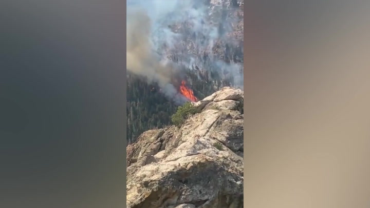 Helicopter drops water on Utah's Halfway Hill fire
