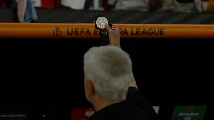 Jose Mourinho gives his Europa League runner-up medal to fan in the crowd