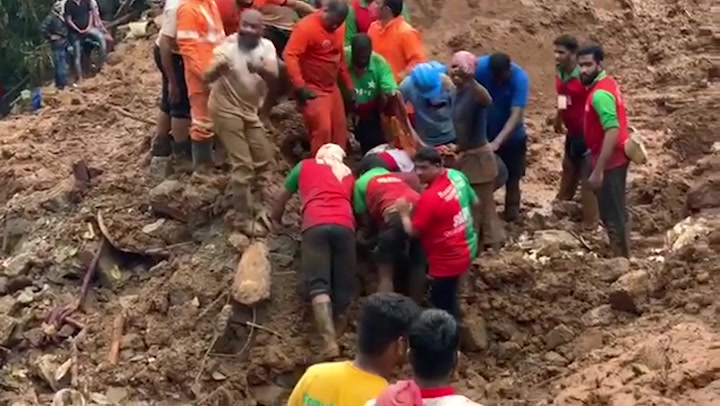 Rescue workers recover bodies from Kerala landslide
