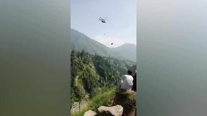 Pakistan cable car rescue team winches one child to safety