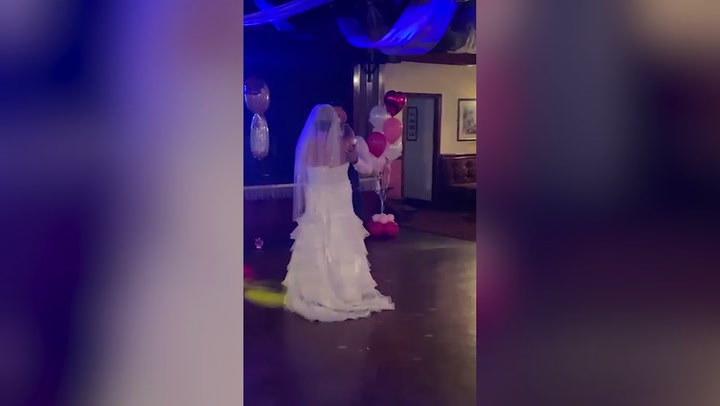 Loved up newlyweds surprise wedding guests with unborn child's gender reveal