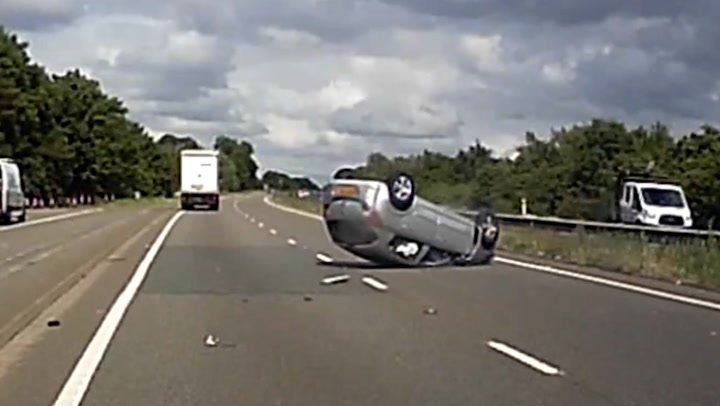 Moment drunk driver collides with lorry and flips car over