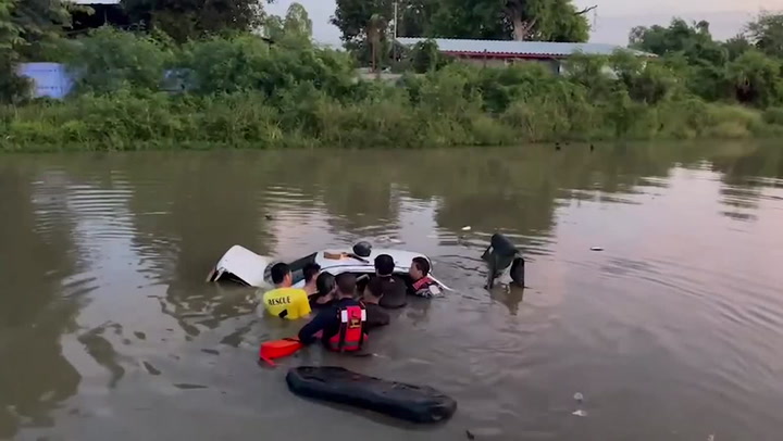 Driver rescued from car submerged in canal 'after dozing off at the wheel'