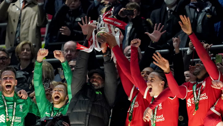 Klopp and Van Dijk lift League Cup trophy after Liverpool win in extra time