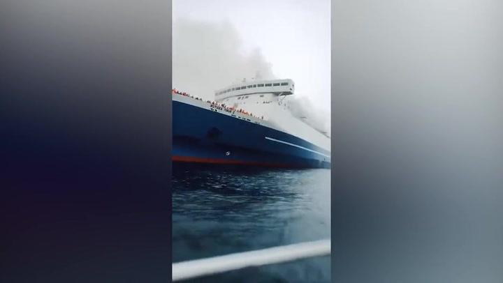 Smoke rises from ferry carrying 271 passengers after it catches fire off coast of Bali