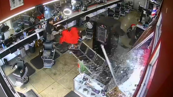 Customer has incredibly close shave when truck crashes into barbershop