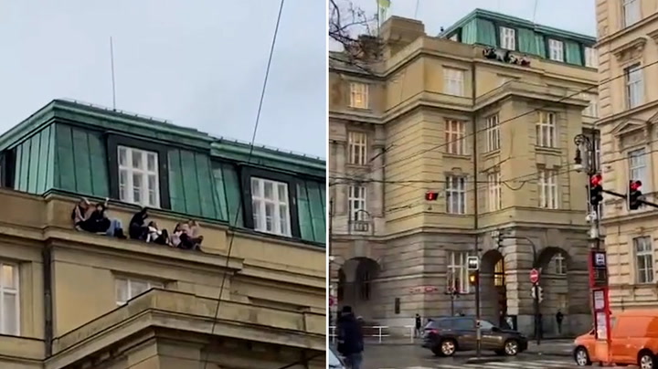 People cling to Prague university building ledge during mass shooting