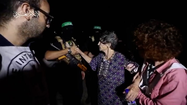 Elderly hostage shakes hands with Hamas captor after release in propaganda footage