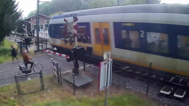 Woman narrowly avoids speeding train on crossing