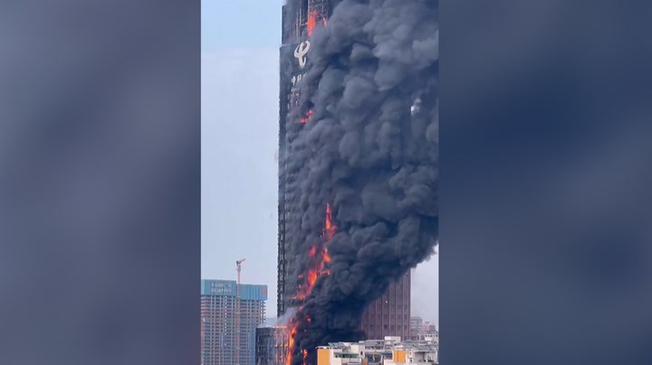 Thick smoke rises as major fire engulfs skyscraper in southern China