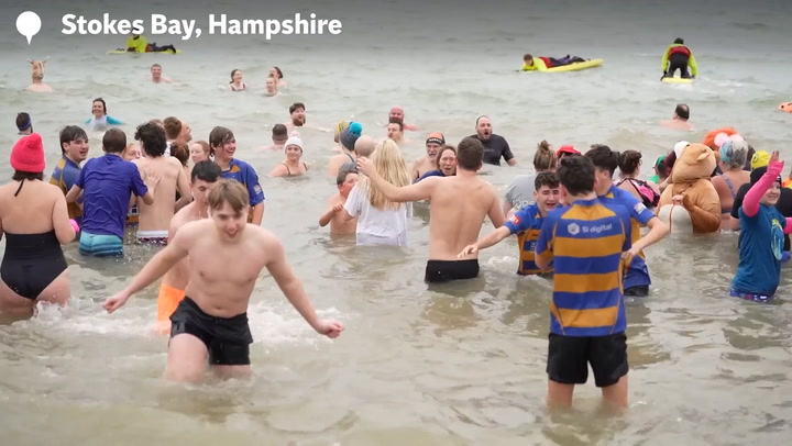 Hundreds brave icy waters for New Year’s Day dip