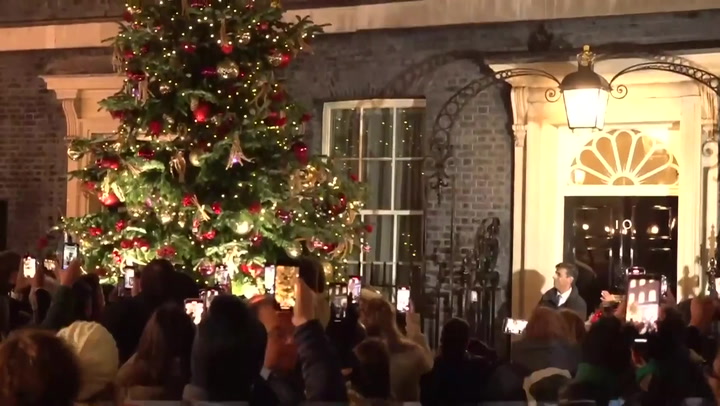 Sunak switches on Downing Street Christmas tree lights