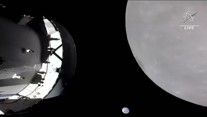 Nasa's Orion space capsule flies by the Moon for first time in 50 years