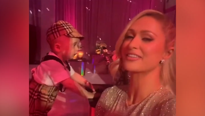 Paris Hilton shares video of son Phoenix dancing as she throws pink birthday-themed party