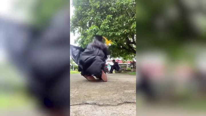 Student celebrating graduation stumbles down stairs in amusing photoshoot fail