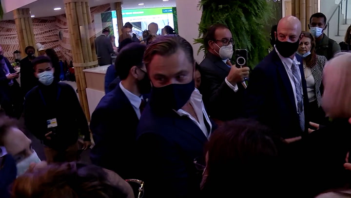 Cop26: Protester shouts at Leonardo DiCaprio about fracking on indigenous land