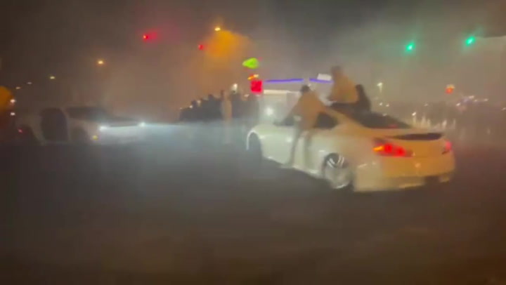 Drivers perform illegal doughnuts and burnouts as crowds take over Philadelphia intersection