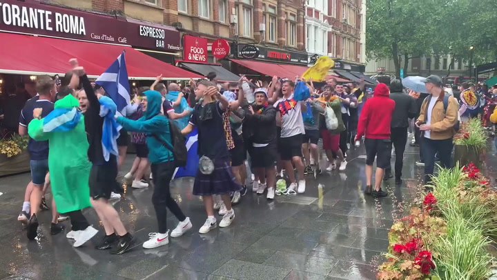 Fans conga through Leicester Square ahead Euro 2020 match