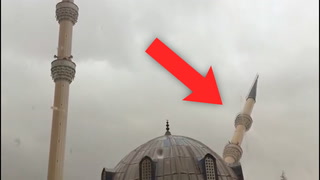 Watch as windstorm sends mosque tower tumbling to the streets below