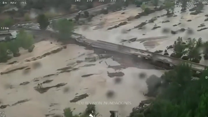 Spain floods: Aerial footage captures partially collapsed bridge
