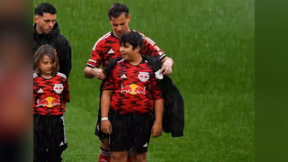 New York Red Bulls give coats to young mascots during torrential rain