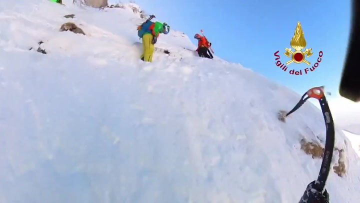 Moment three explorers rescued from icy Italian mountain