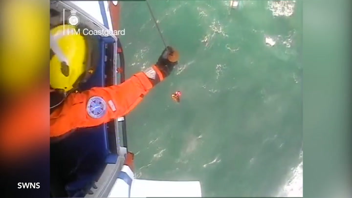 Moment woman swept out to sea is rescued by coastguard after they ...