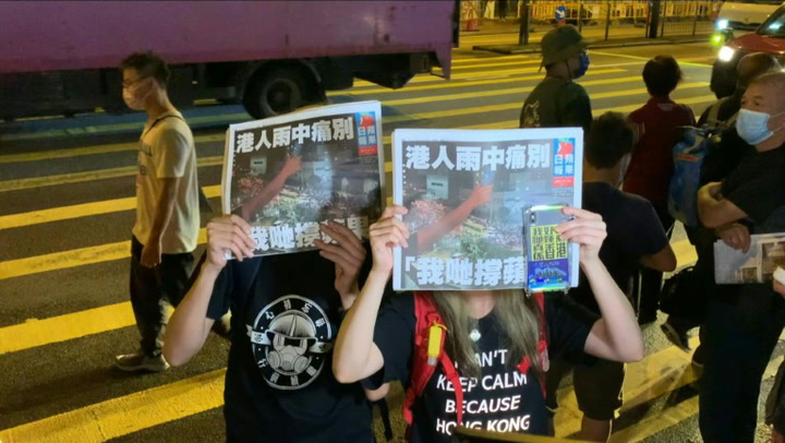 Hong Kongers queue for last edition of pro-democracy paper Apple Daily