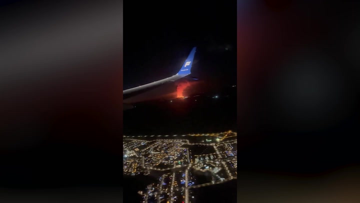 Iceland's volcano eruption seen from plane window in passenger footage
