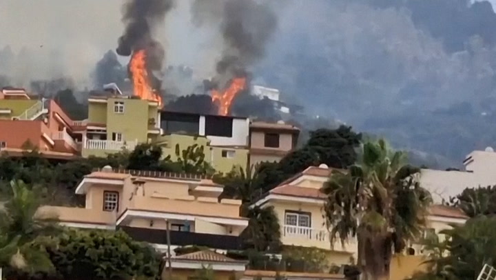 House burns as raging wildfires force thousands to evacuate in Tenerife