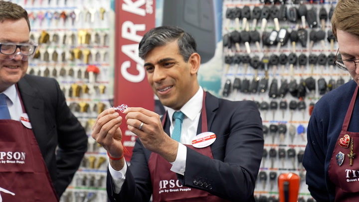 Rishi Sunak dons red apron and goggles and gets to work cutting keys on visit to Timpsons