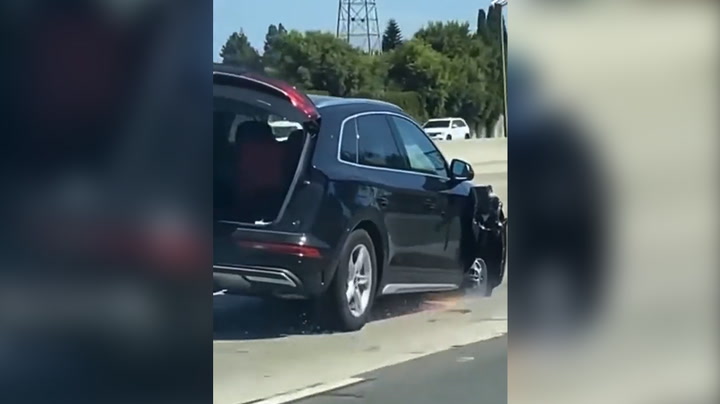 Sparks fly as woman drives Audi down California freeway without front tyre