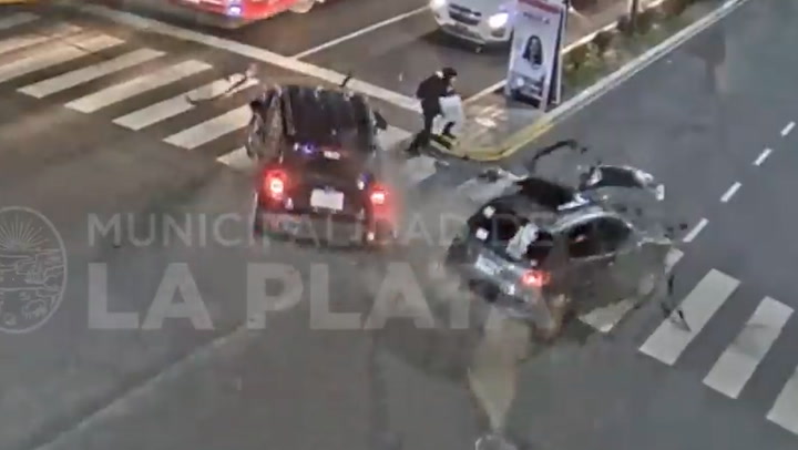 Pedestrian narrowly misses two colliding cars