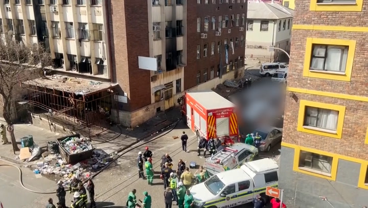 230831-2body Bags Line Street Outside Johannesburg Building After Devastating Fire Kills 73-