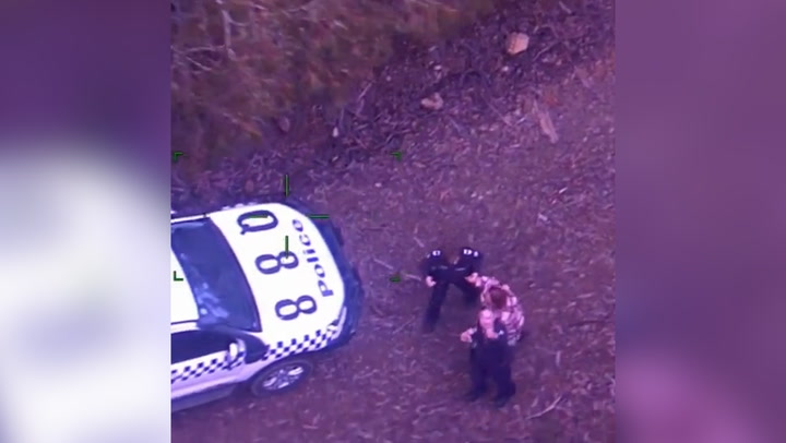 Woman stranded in Australian bush with only bottle of wine rescued by police