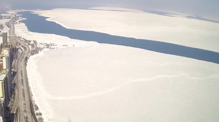 Huge ice sheet breaks off Lake Michigan shoreline