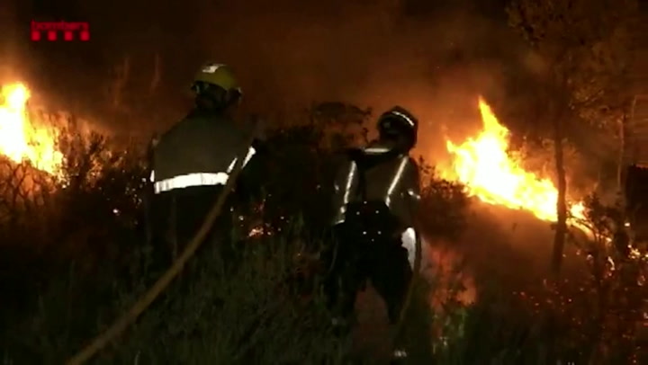 Firefighters battle spread of wildfire in Catalonia