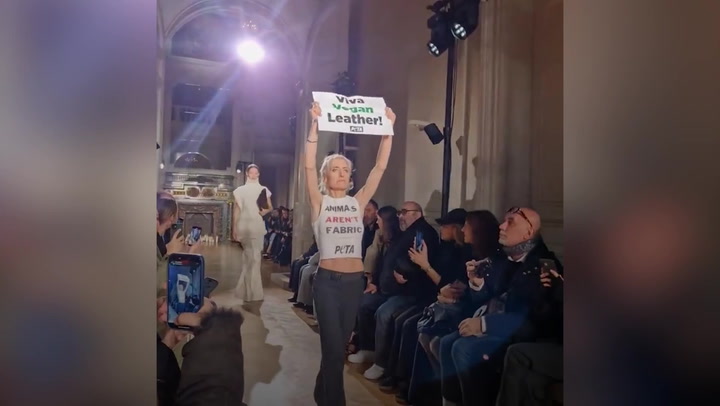 Victoria Beckham's Paris Fashion Week show crashed by animal rights protesters