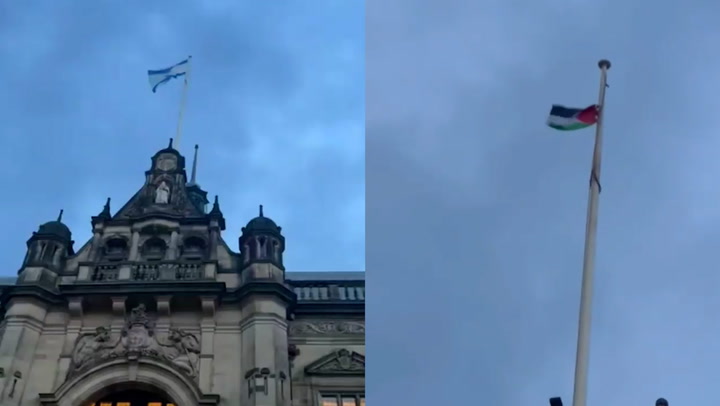 Man scales town hall roof to pull down Israeli flag and replace with Palestine symbol
