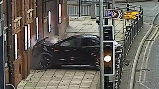 Moment man deliberately drives car into UK theatre during rush hour