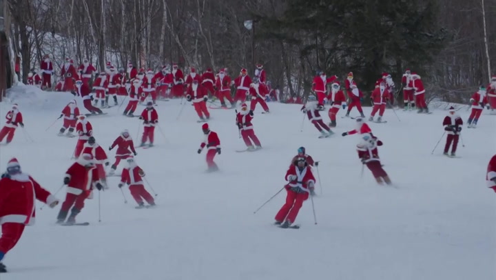 More than 200 skiing Santas hit the slopes in Maine