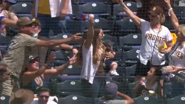Moment mum catches baseball one-handed from the stands while holding her baby